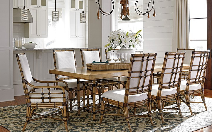 Twin Palms dining room features a dining table with eight rattan dining chairs.